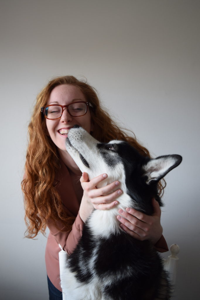 woman petting her dog